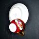 Limoges precious porcelain cup decorated in fuchsia pink and gold, signed MAB