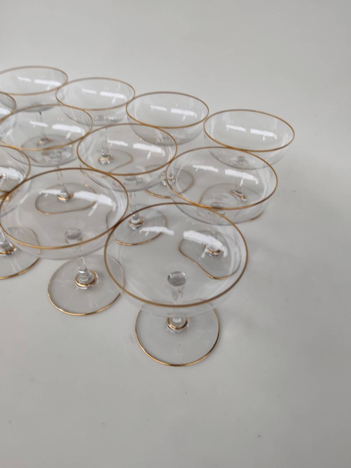 12 Baccarat crystal champagne coupes, circa 1900.