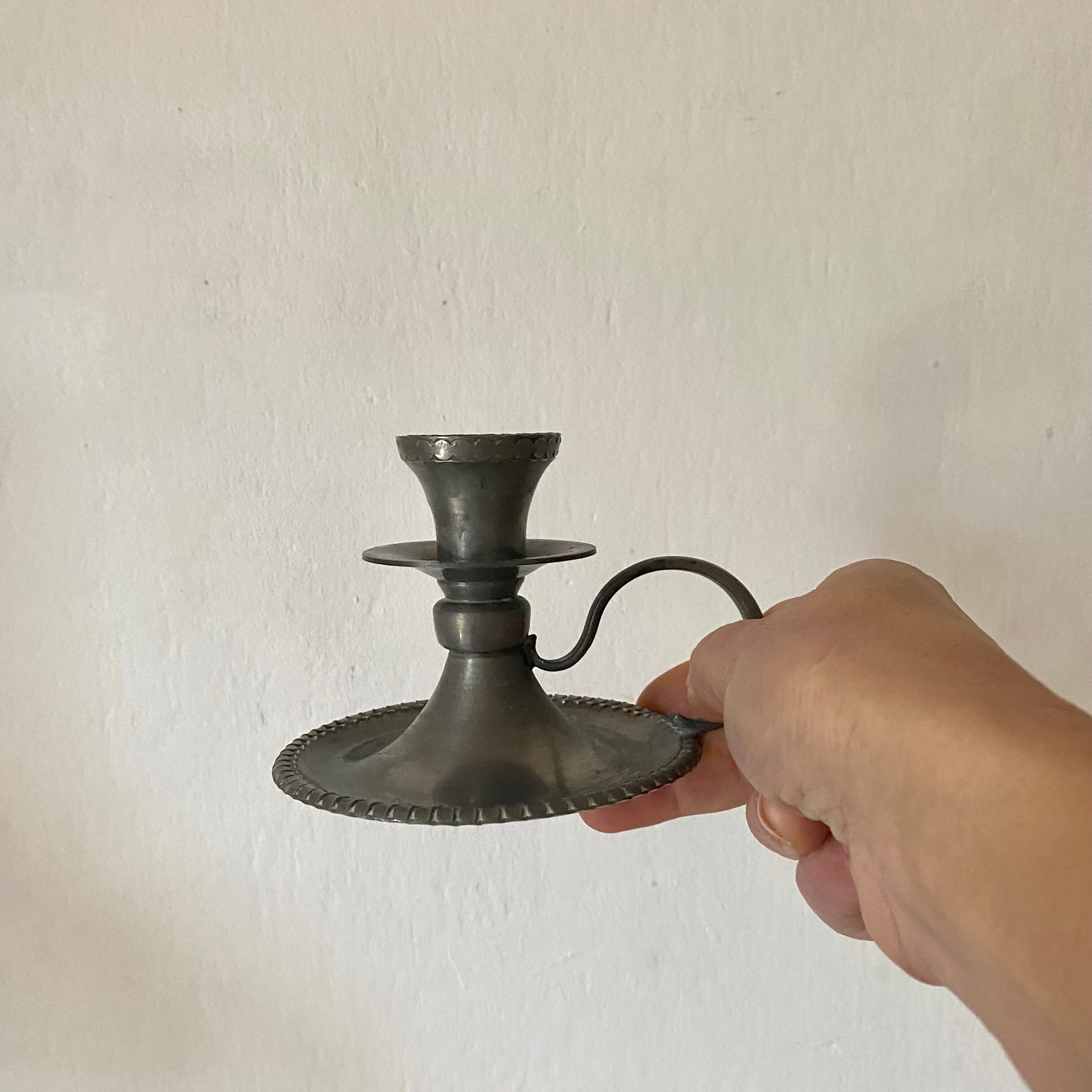 Tin thumb candle holder