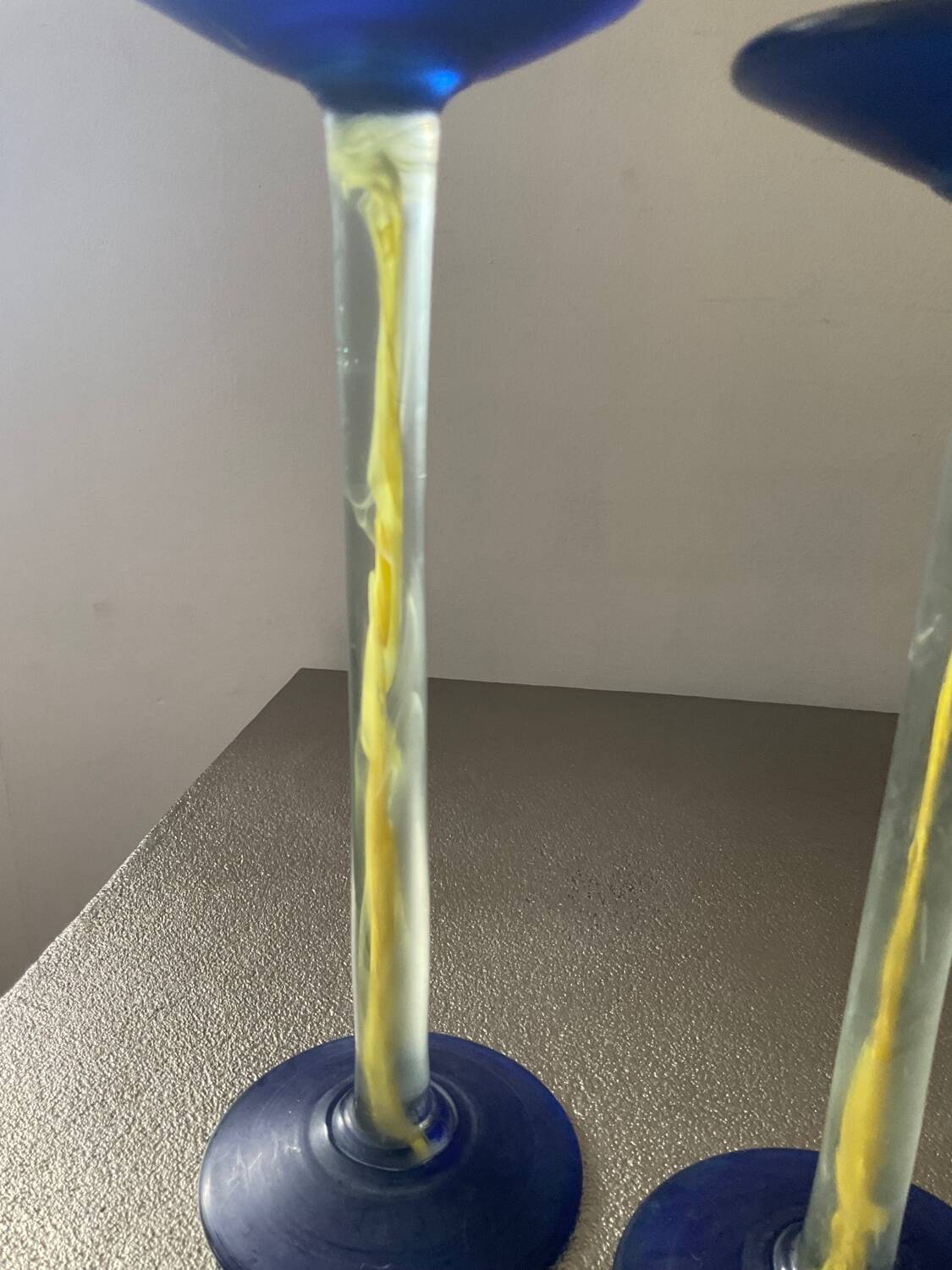 Duo of vintage Kosta Boda candlesticks in glass paste