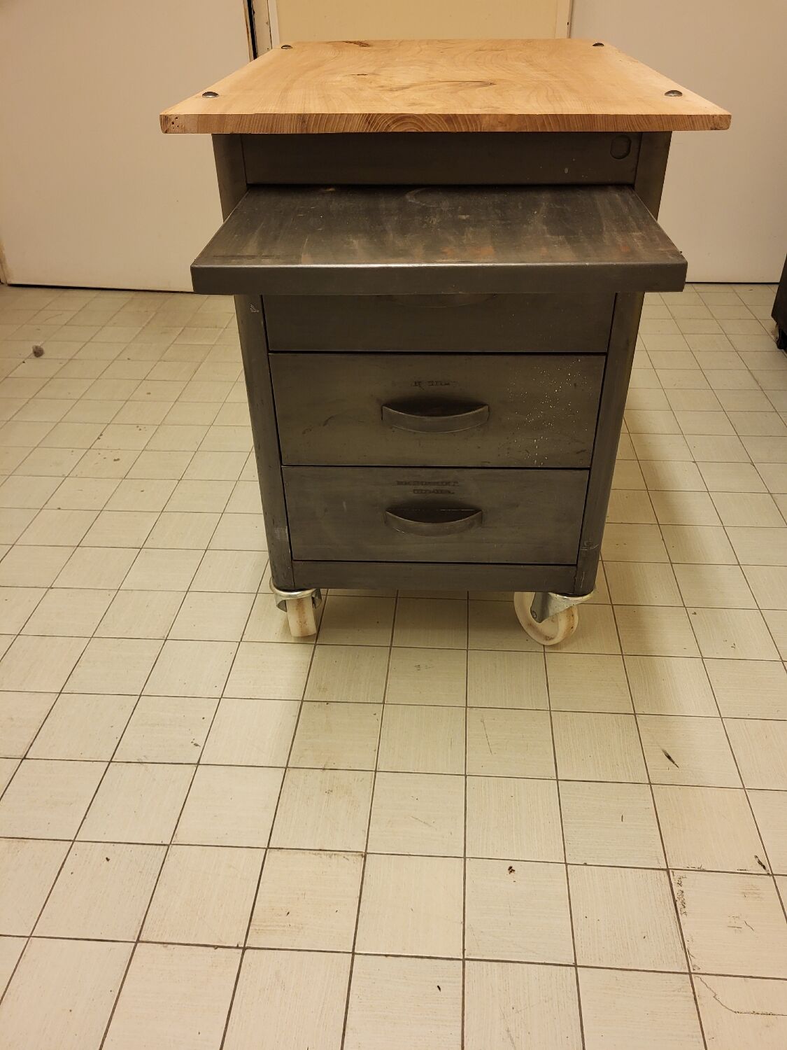 Wood and waxed metal furniture on casters