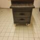Wood and waxed metal furniture on casters