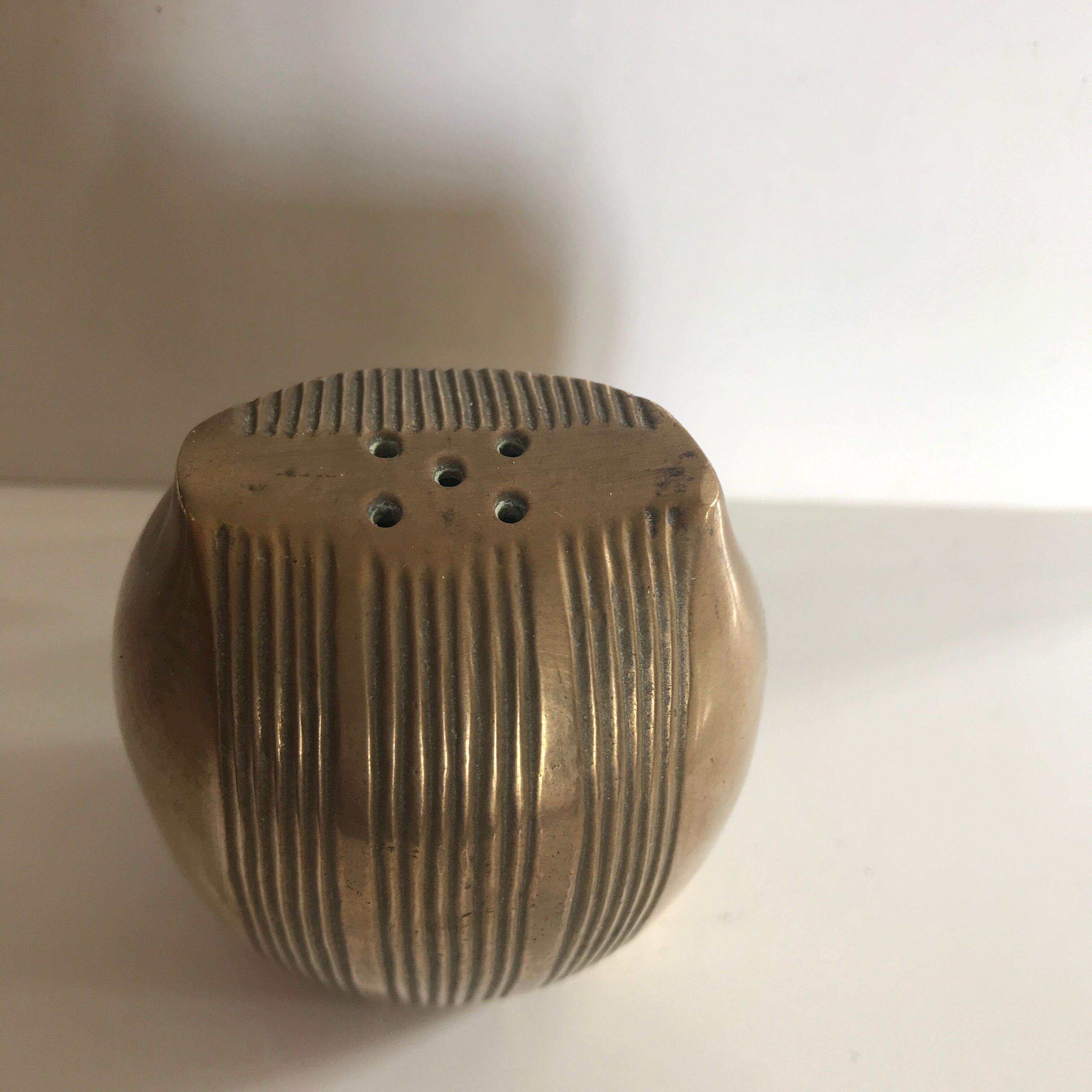 Brass owl wears incense