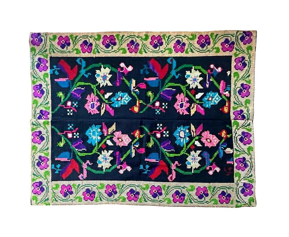 Romanian wool carpet floral design with green border on black background 180x153cm