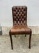 Brown leather tufted Chesterfield chair