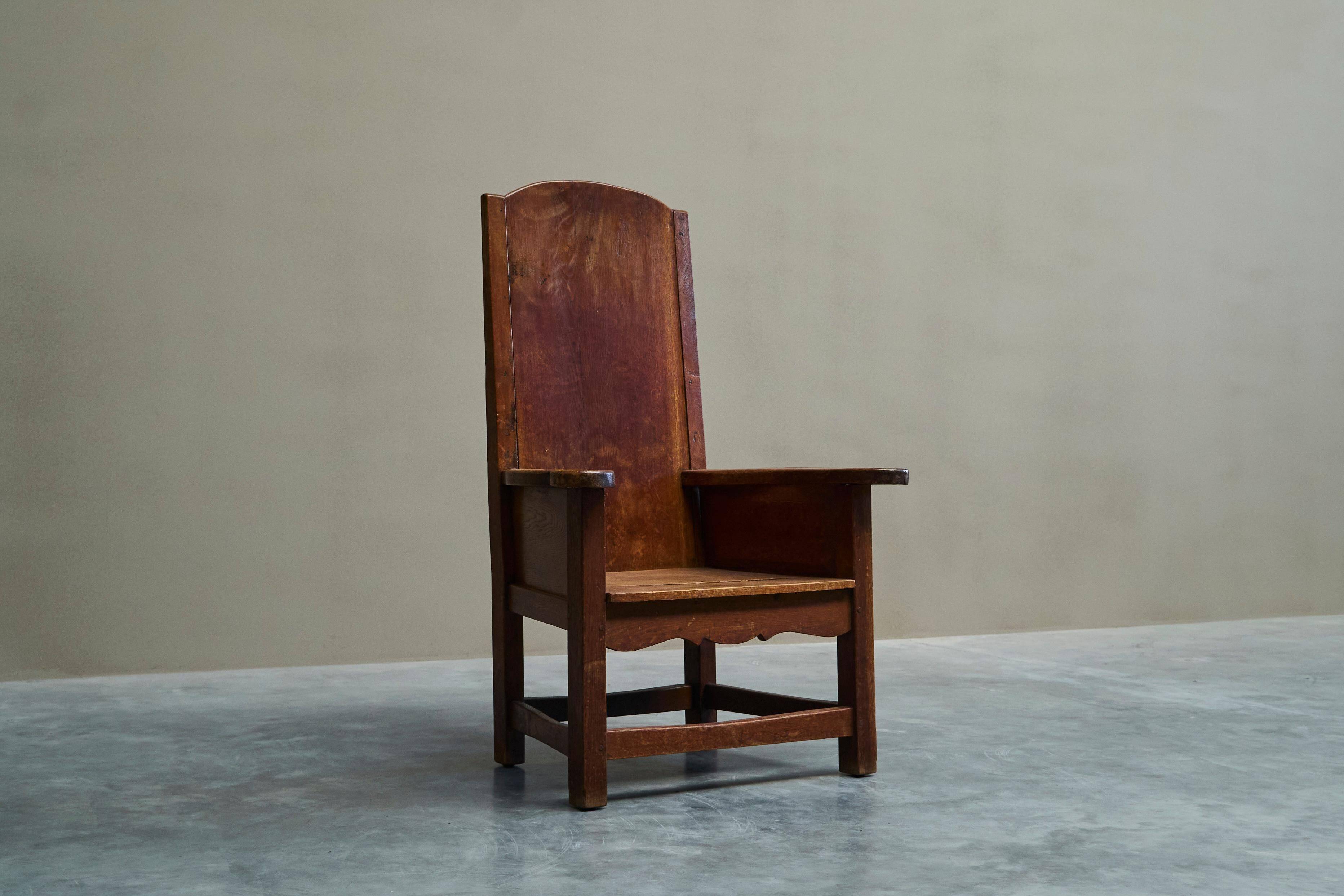Antique solid oak armchair, 19th-century farmer style.