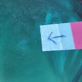 Blown glass vase with a flared neck and wavy rim.