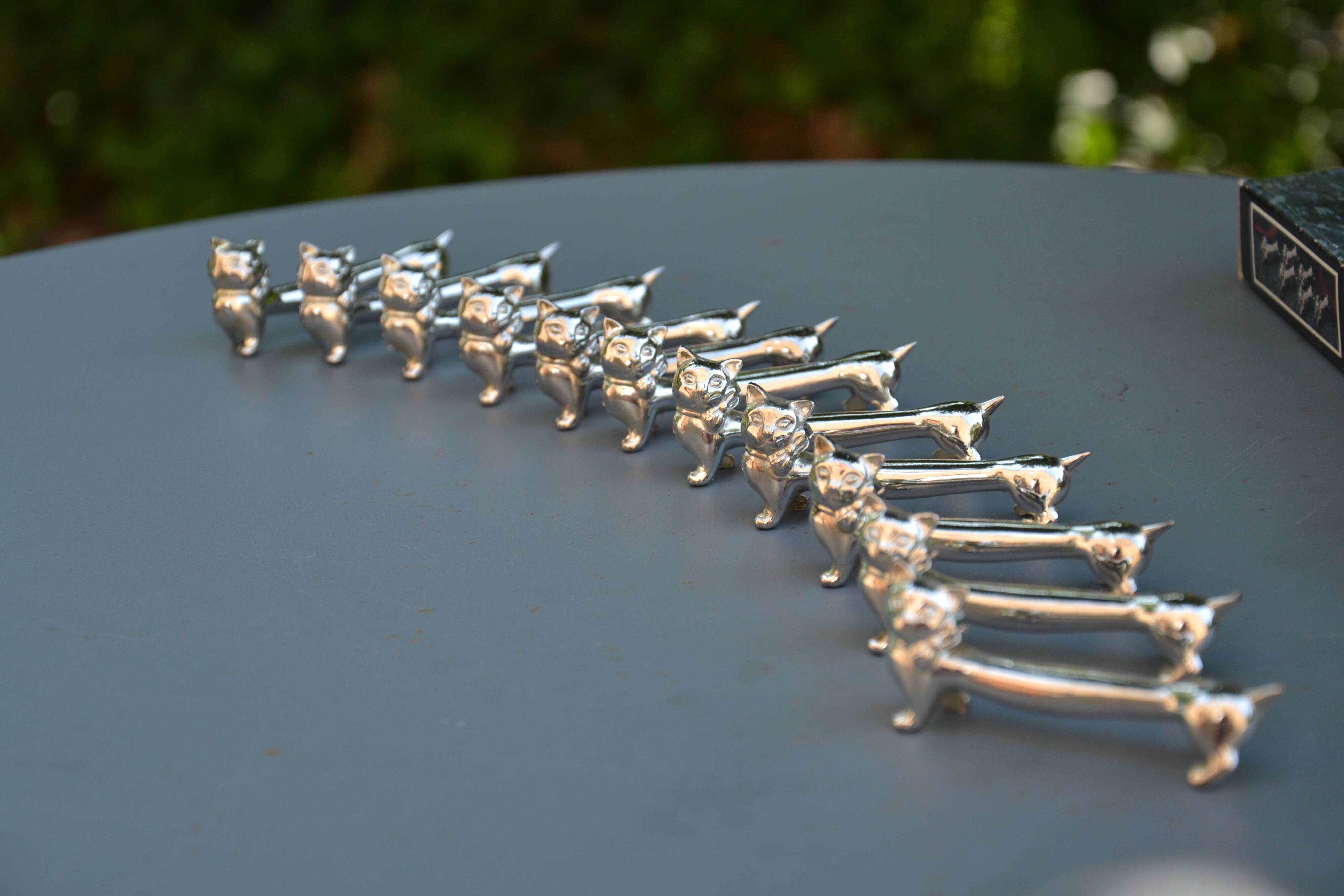 12 silver-plated cat knife rests