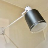 Pair of long white arm wall lights with black spot. "lita device"