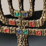 Menorah/Candlestick with 7 light arms. In old gold patinated brass/Decor 12 astrological signs. Engraved Jerusalem. Height 14 cm