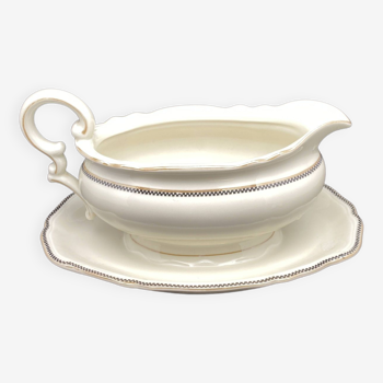 Porcelain gravy boat with black and gold checkerboard edging