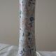 Table lamp for bedside use in earthenware with a wooden base.