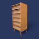 Vintage rattan chest of drawers with splayed legs from the 1950s.