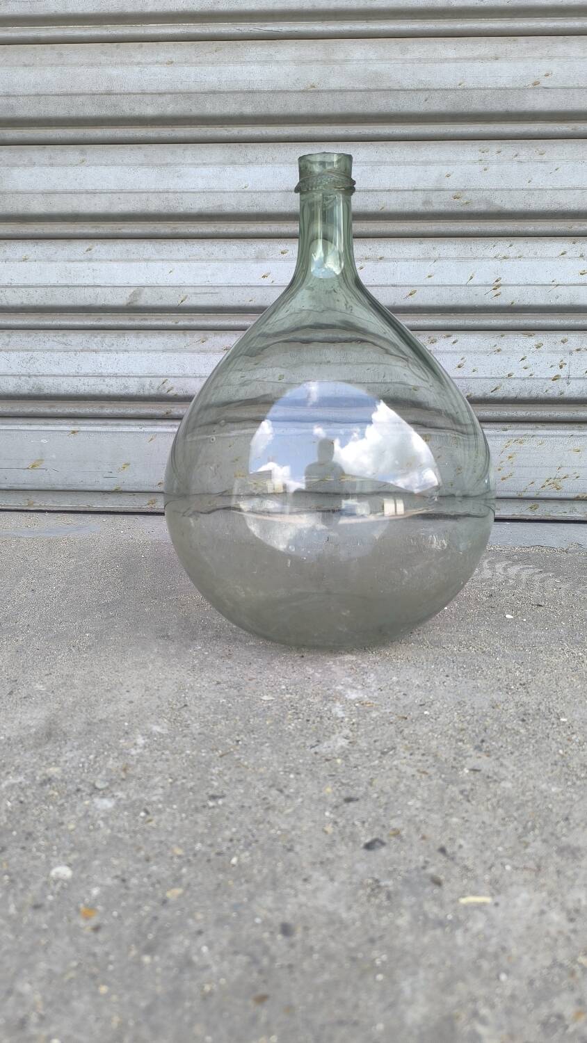 Green demijohn in blown glass