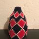 Berber wool and red and black raffia basket