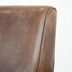 Fauteuil en cuir de mouton élégant et stylé avec un design épuré.