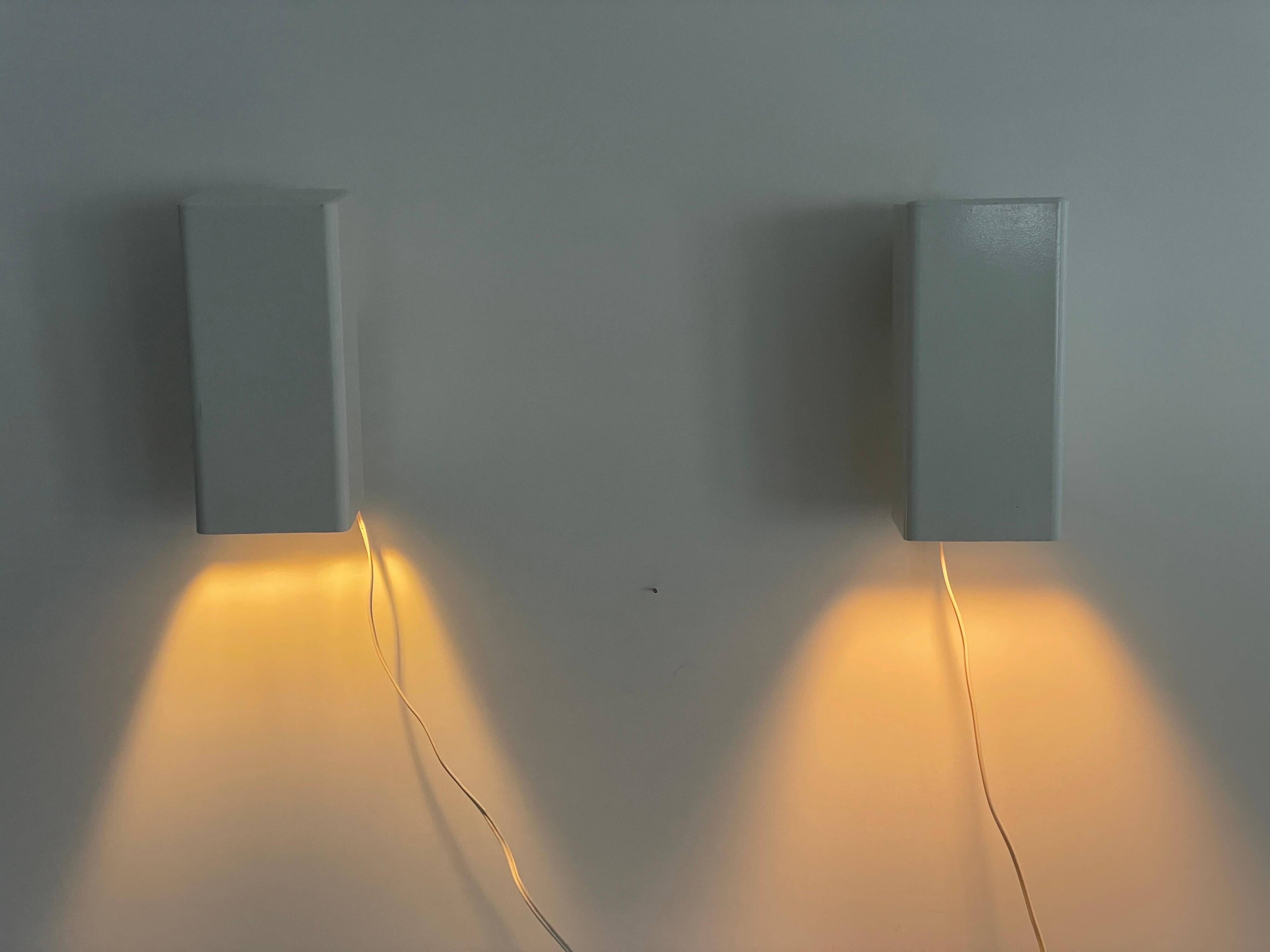 Pair of minimalist white metal wall lights from the mid-century, 1960, Germany.