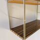 Golden wire shelf in metal with a wood effect.