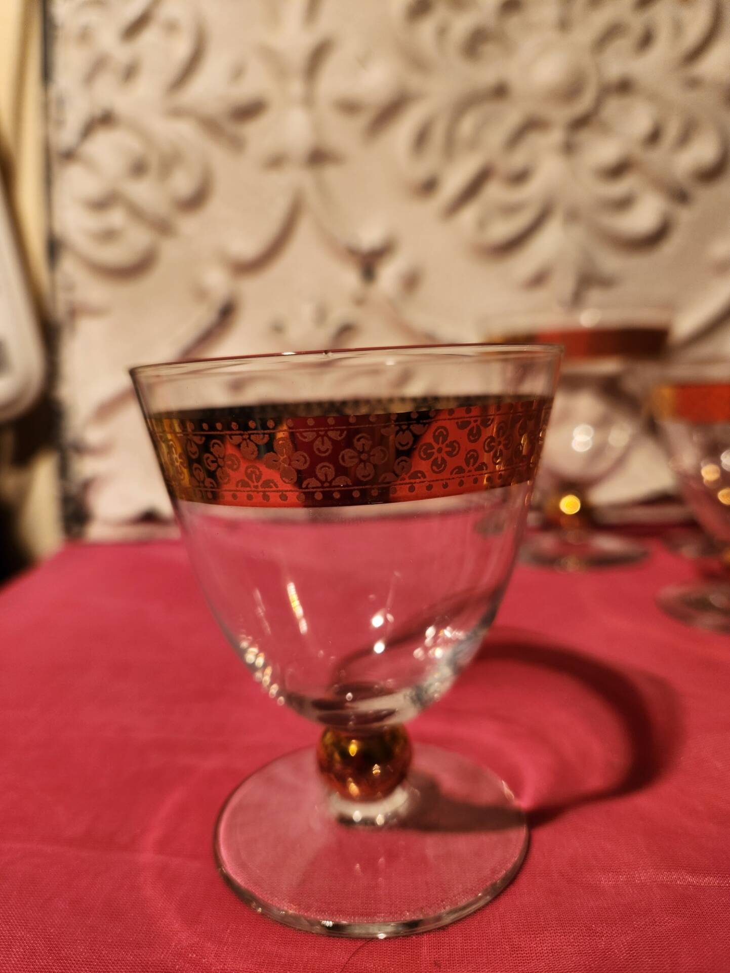 1930s footed glass service with gilding, including champagne flutes.
