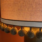 Copper "bouillotte" lamp with Ashoka Silk shade, pom-poms of c