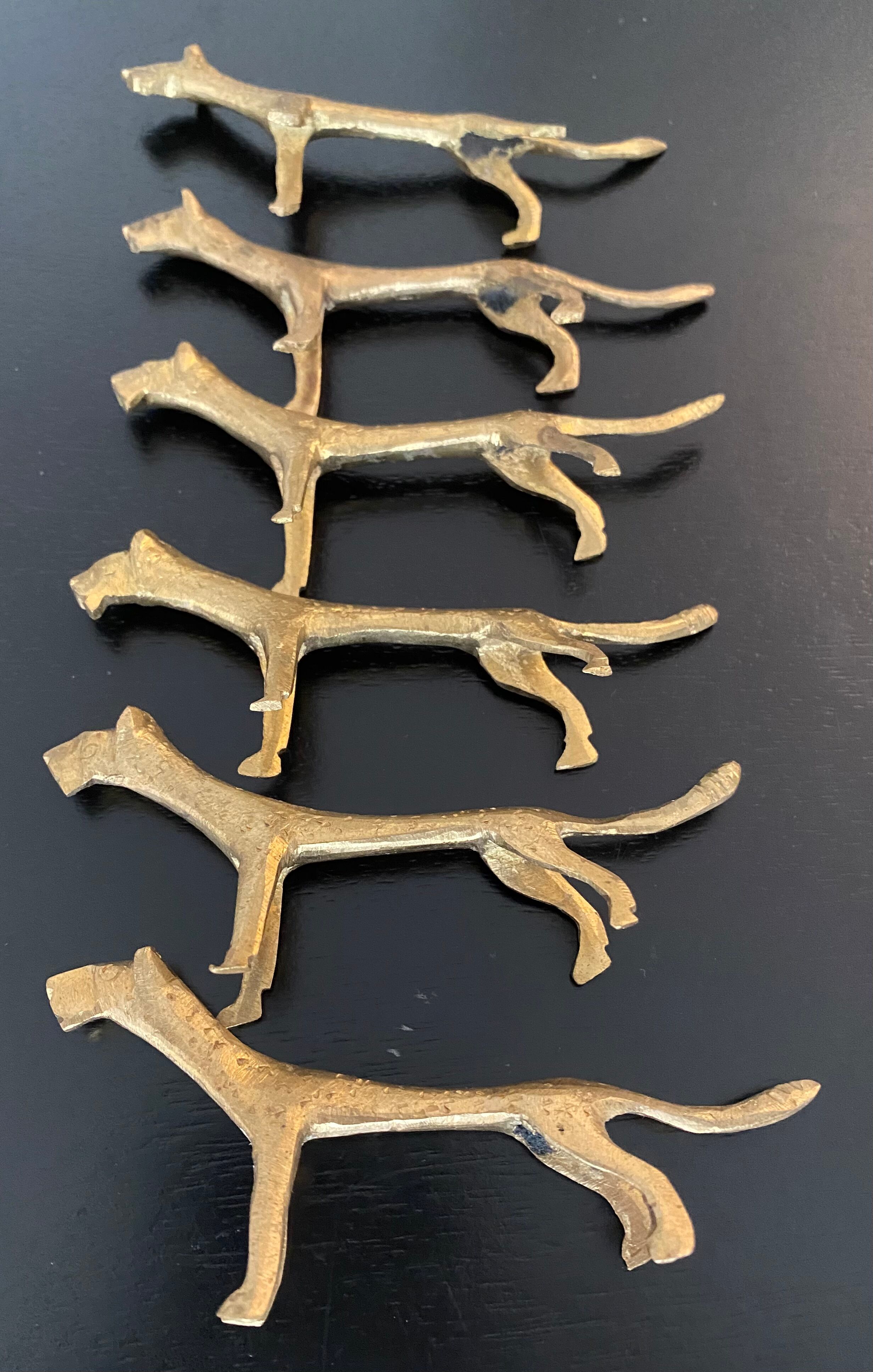 6 lioness-shaped brass knife holders