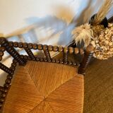 Corner chair in turned wood and straw
