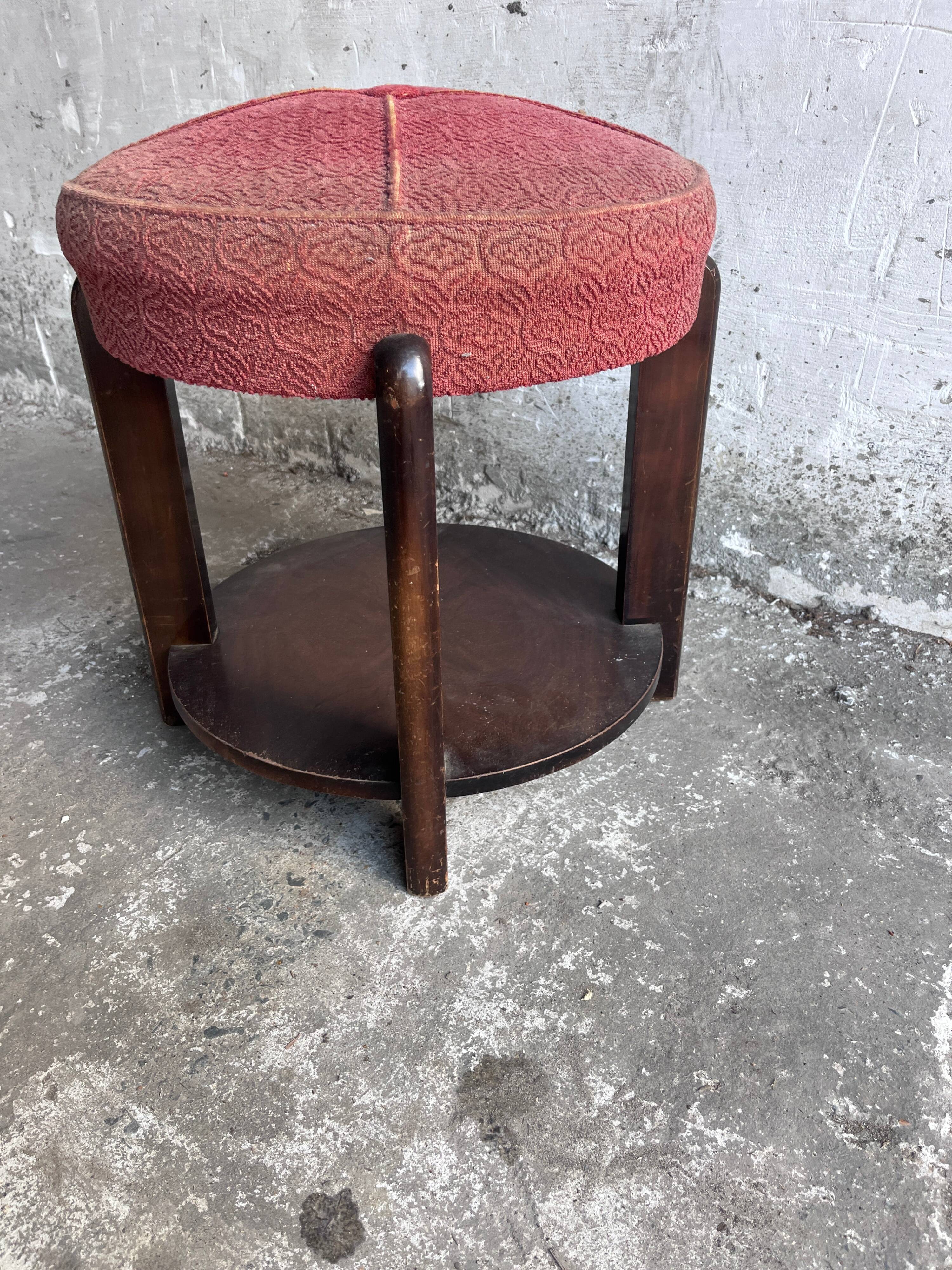 Art Deco stool upholstered with a lower shelf, France, circa 1930.