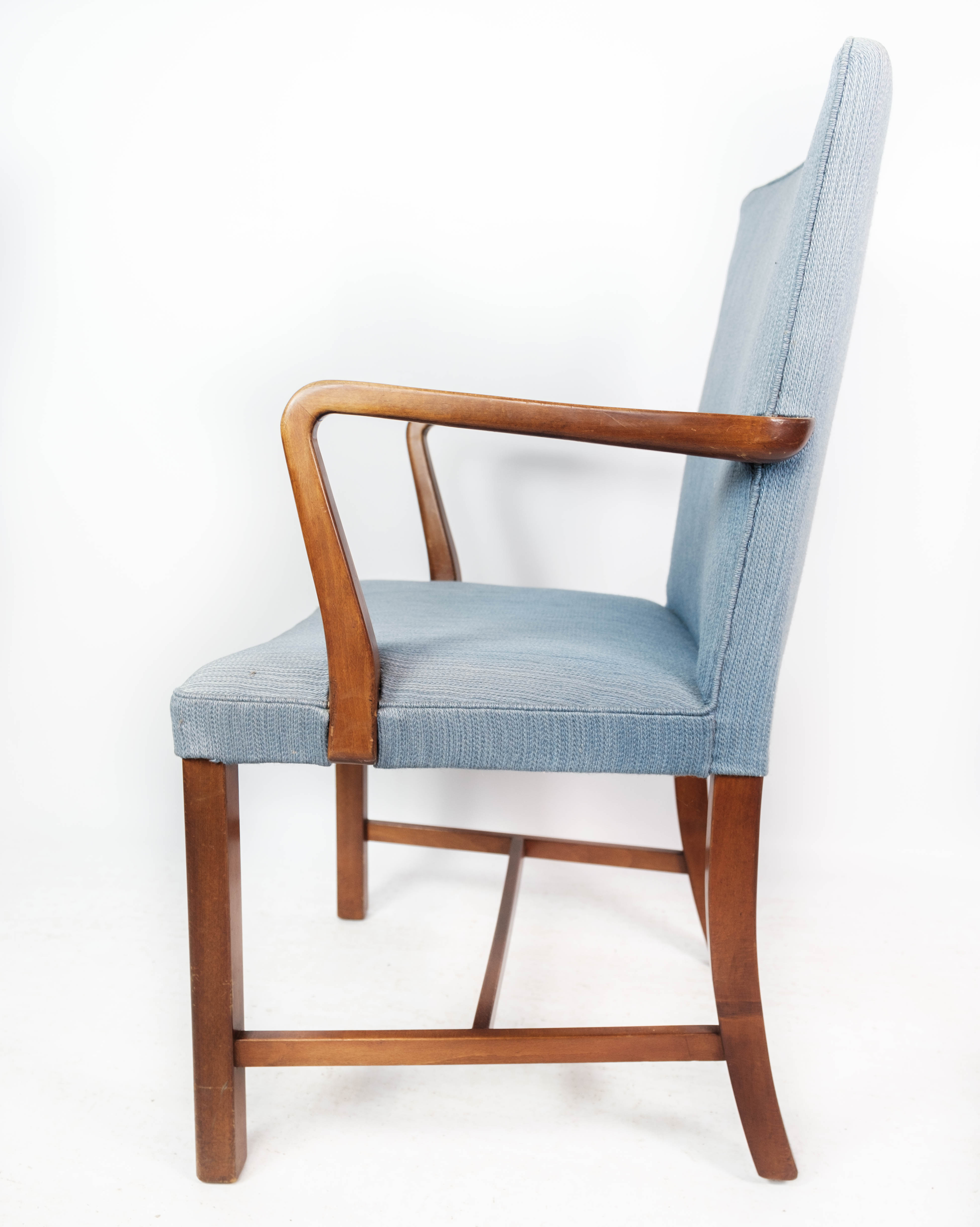 Armchair in mahogany and upholstered with light blue fabric by Fritz Hansen
