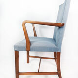 Armchair in mahogany and upholstered with light blue fabric by Fritz Hansen