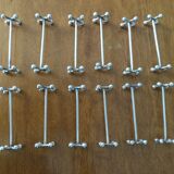 Set of twelve silver metal knife holders signed SFAM