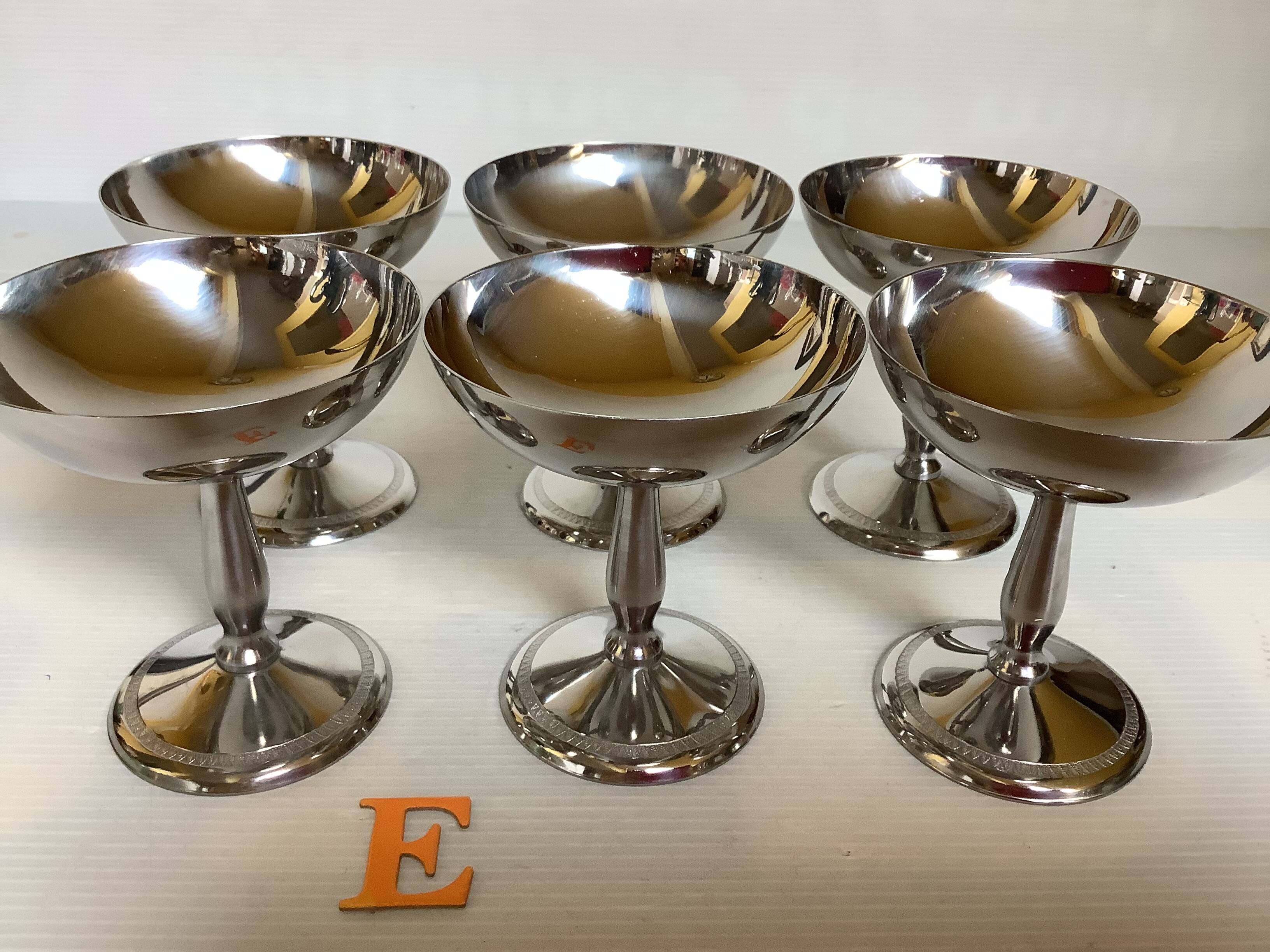 6 footed bowls with silver frieze in metal for ice.