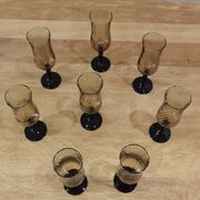 8 vintage smoked champagne flutes with black feet Arcoroc