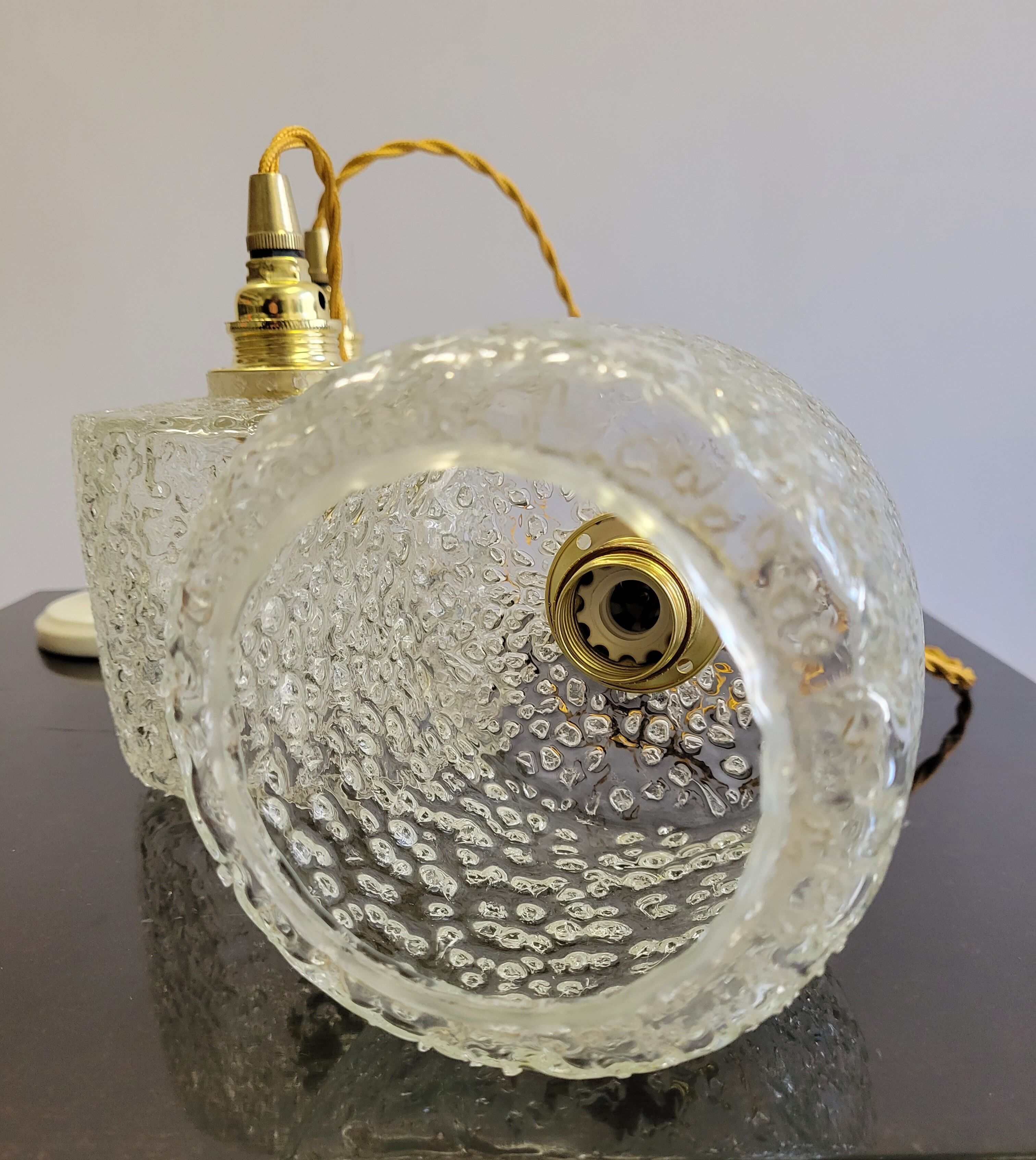 Trio of scrambled glass pendant lamps