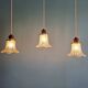 Art Deco trio of pendant lights/table lamps in clear glass, 1920s-30s.