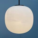 Minimalist suspended glass ball lamp from the vintage German space age by Glashütte Limburg, 1970s.