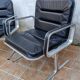 Pair of vintage leather and aluminum armchairs, restored