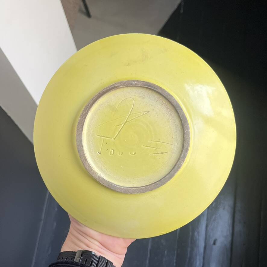 Yellow ceramic plate by Georges Jouve