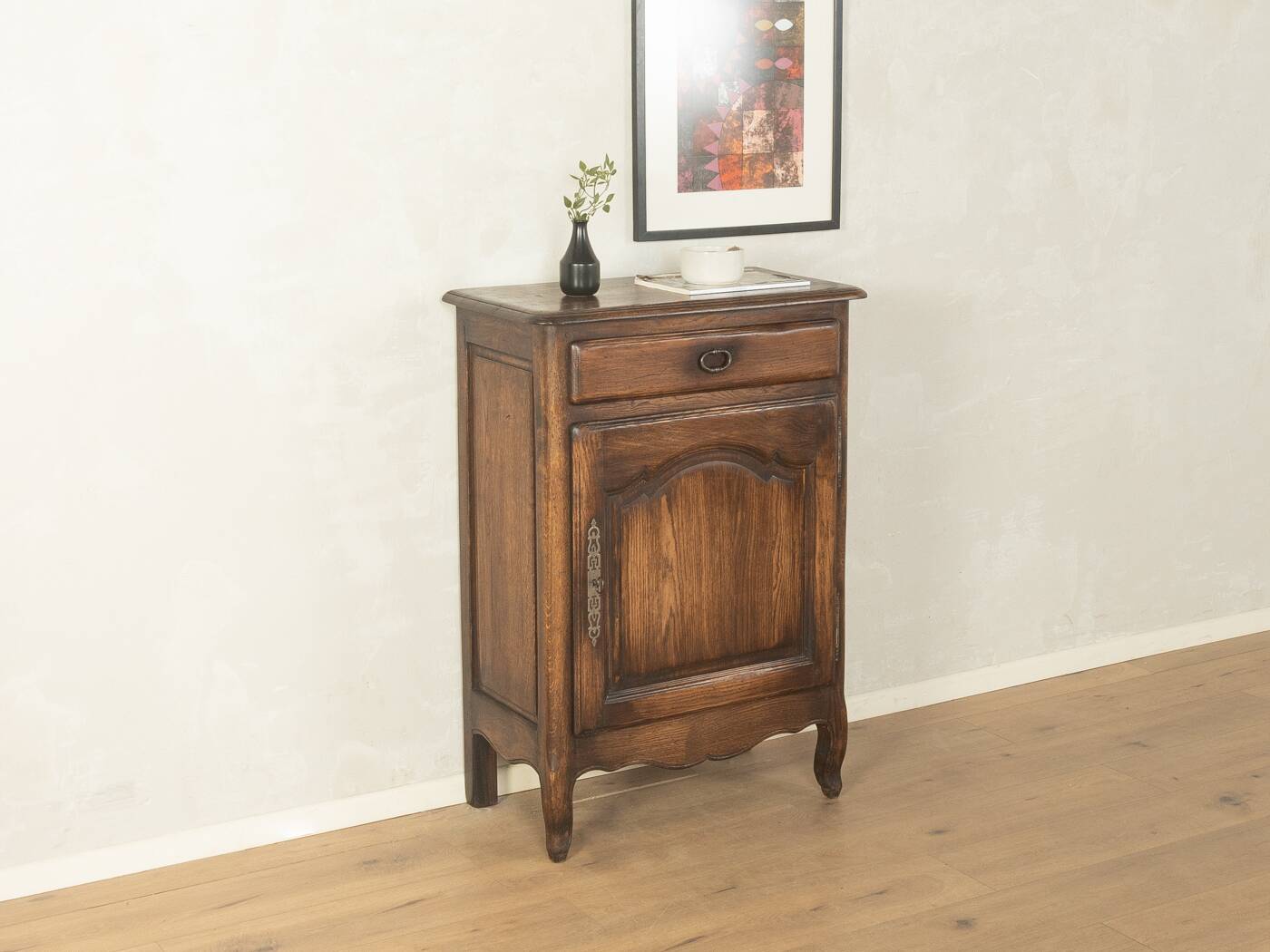Antique chest of drawers with curved silhouette and patina