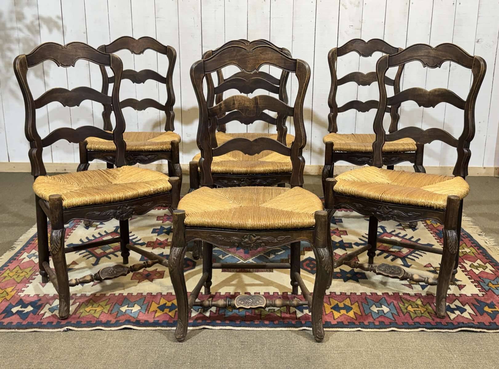 Set of 7 Louis XV style beech chairs with straw seats.