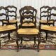 Set of 7 Louis XV style beech chairs with straw seats.