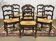 Set of 7 Louis XV style beech chairs with straw seats.