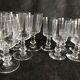 11 glasses and 1 wine carafe