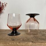 4 pink glasses with black stems