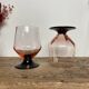 4 pink glasses with black stems