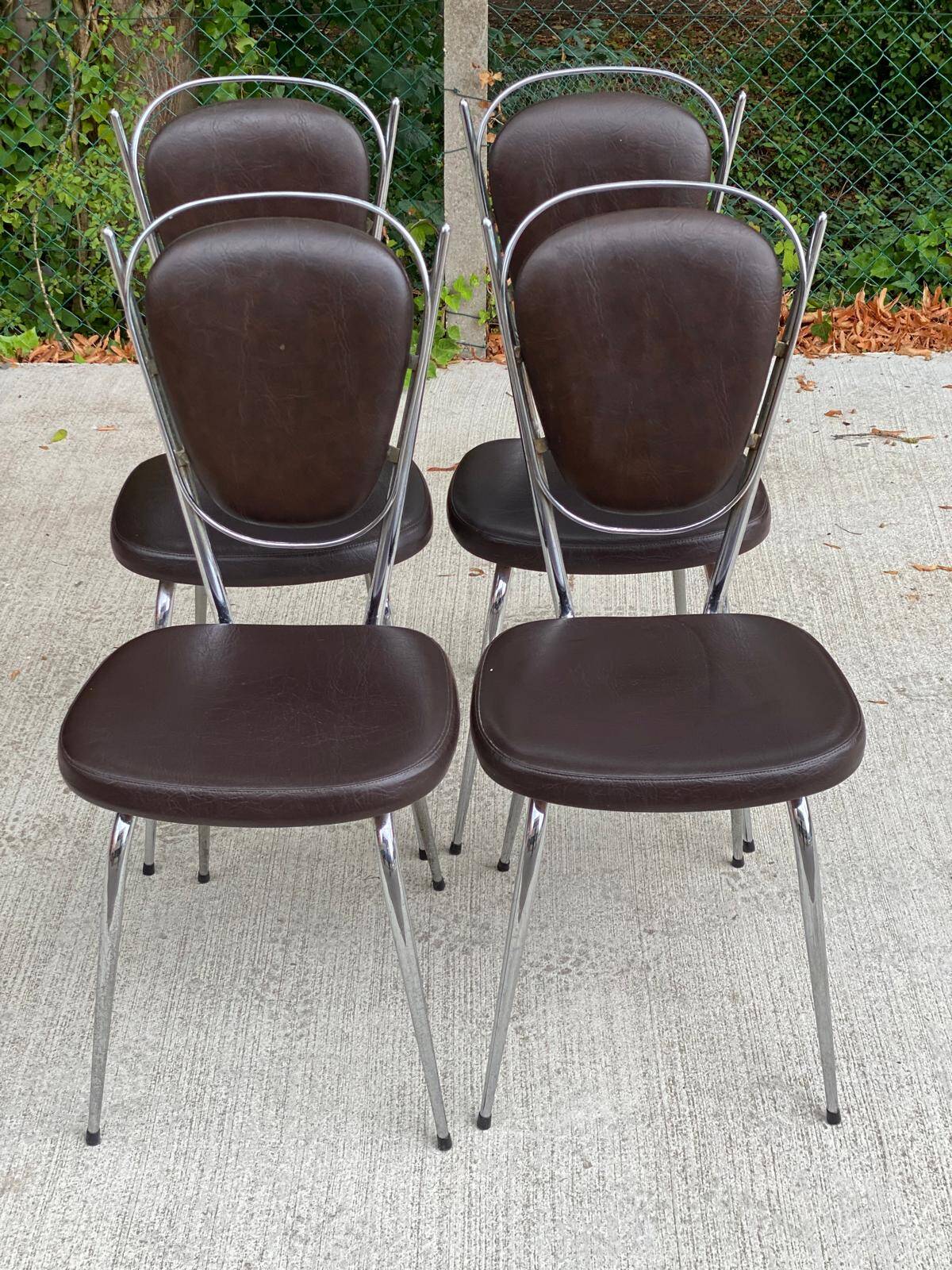 Set of 4 vintage chairs from the 60s/70s in brown faux leather with chrome compass legs.