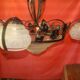 four-armed wrought iron chandelier from the "Art Deco" period (1925)