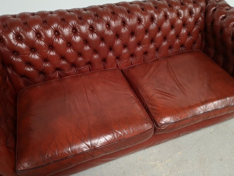 Old red leather Chesterfield sofa