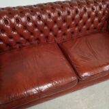 Old red leather Chesterfield sofa