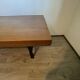 Industrial style table with a mahogany top.