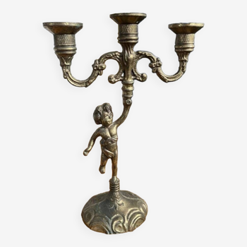 3-light golden candlestick, cherub decoration on base